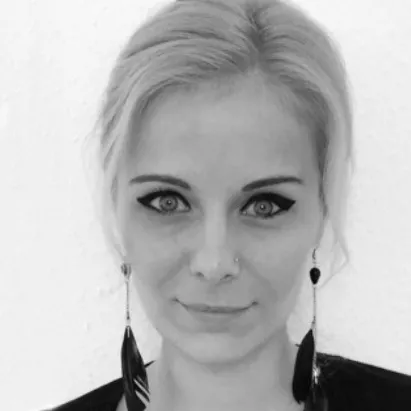 black and white photo of Krisztina Gadnai, finance manager at booked4.us